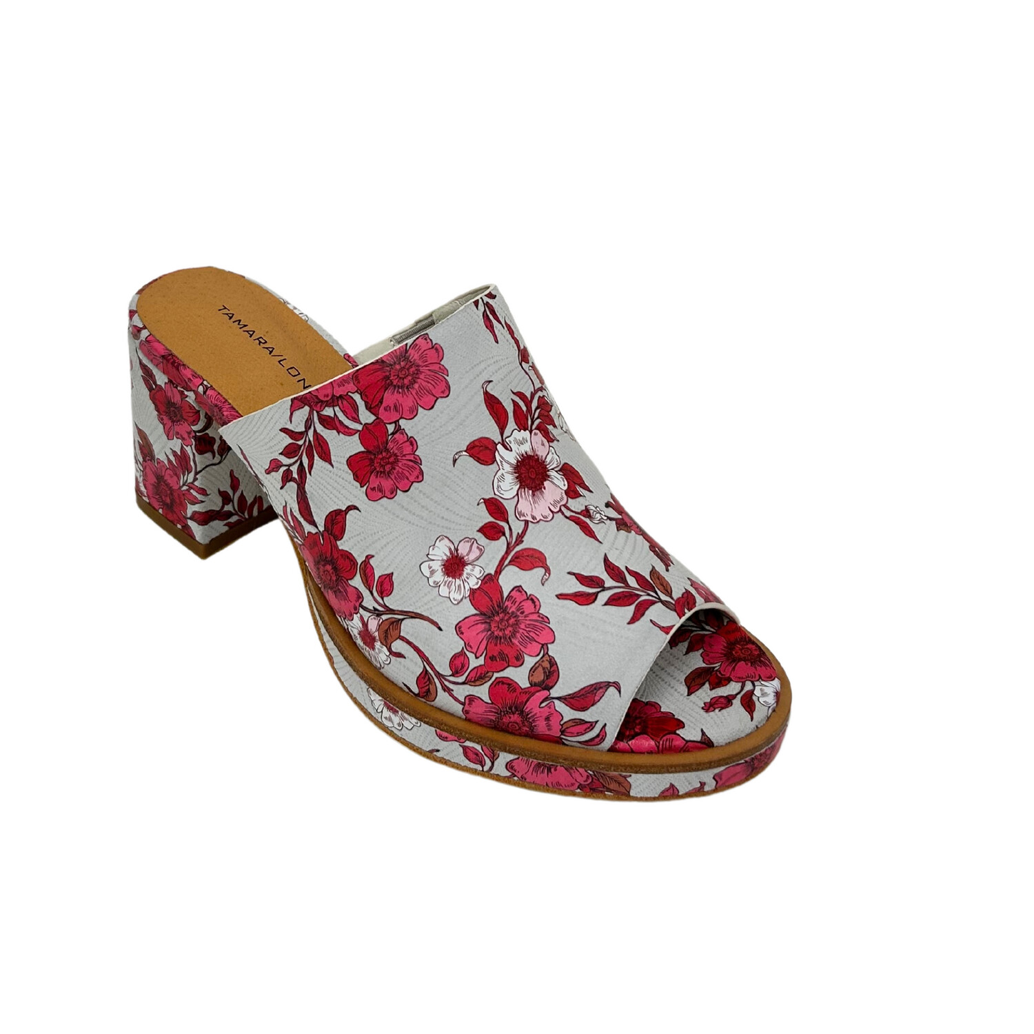 Angled view of a platform mule with a pink/red floral pattern.