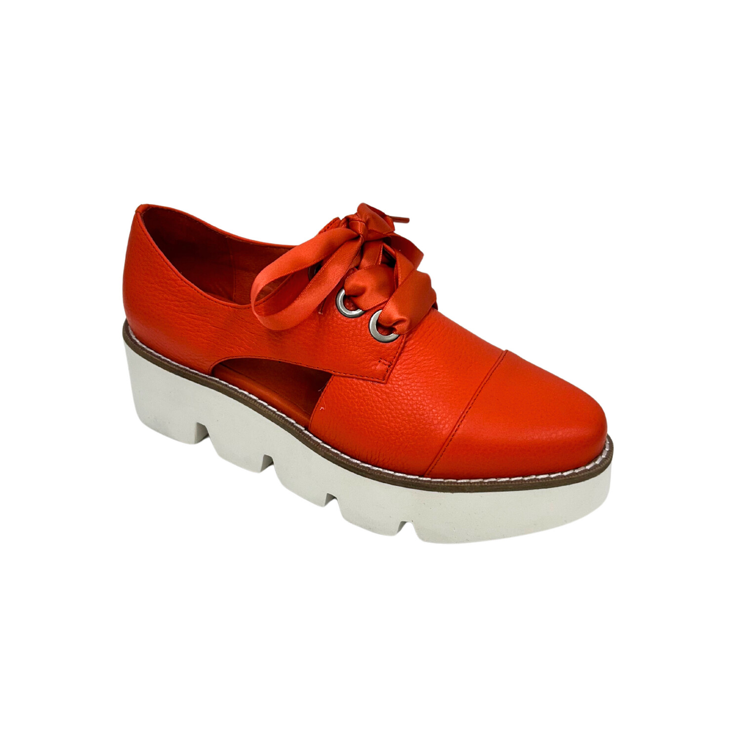 Angled front view of a chunky sole loafer with cut outs at mid foot.  Ribbon laces on top.  Shown in an orange/red leather