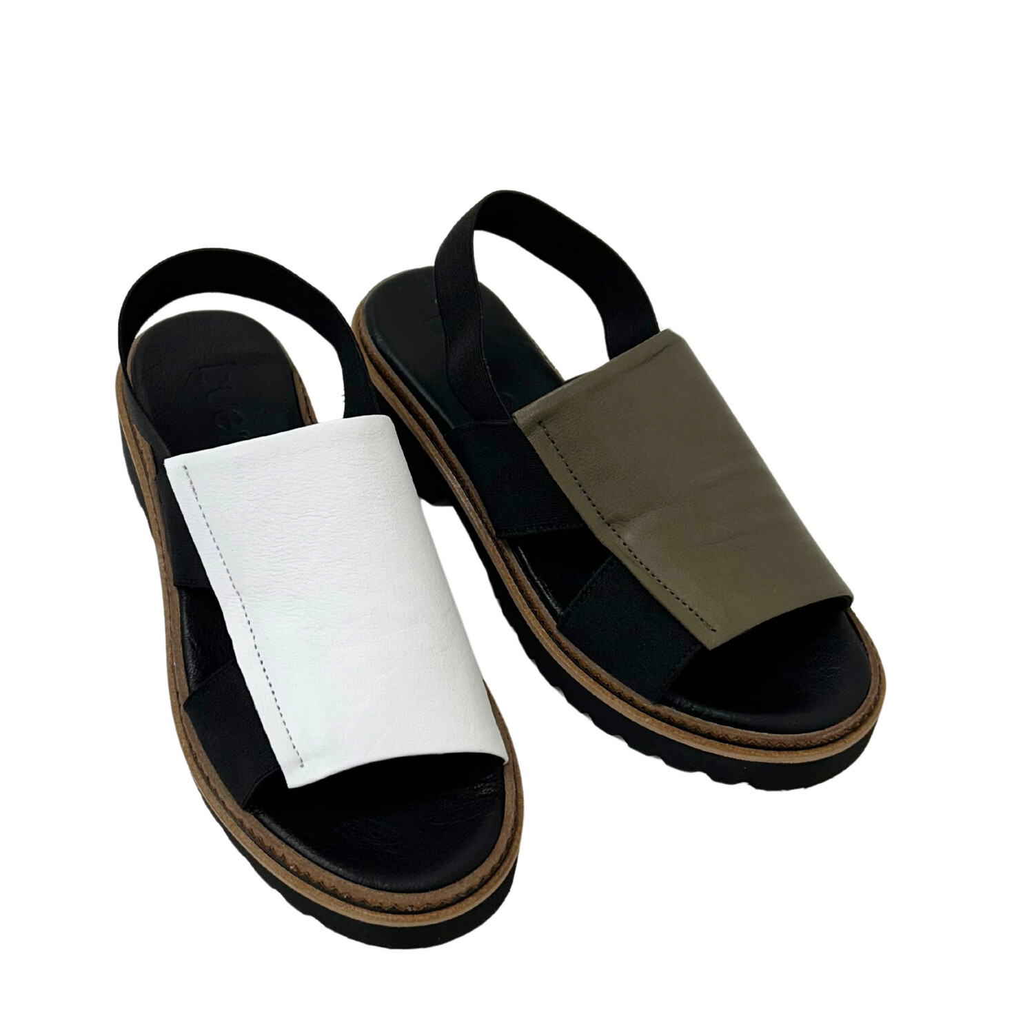 Two colors are shown in a slip on sandal - white and khaki.  Great coverage panel across top of foot.  Open toe and heel with a back strap.