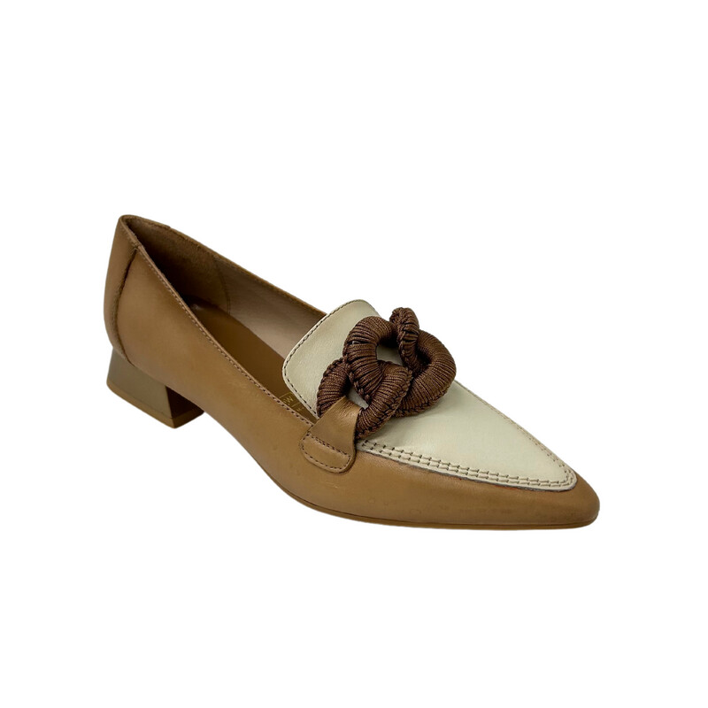 Angled side view of a slip on loafer in a classic taupe and cream leather with a chain embellishment at top of foot