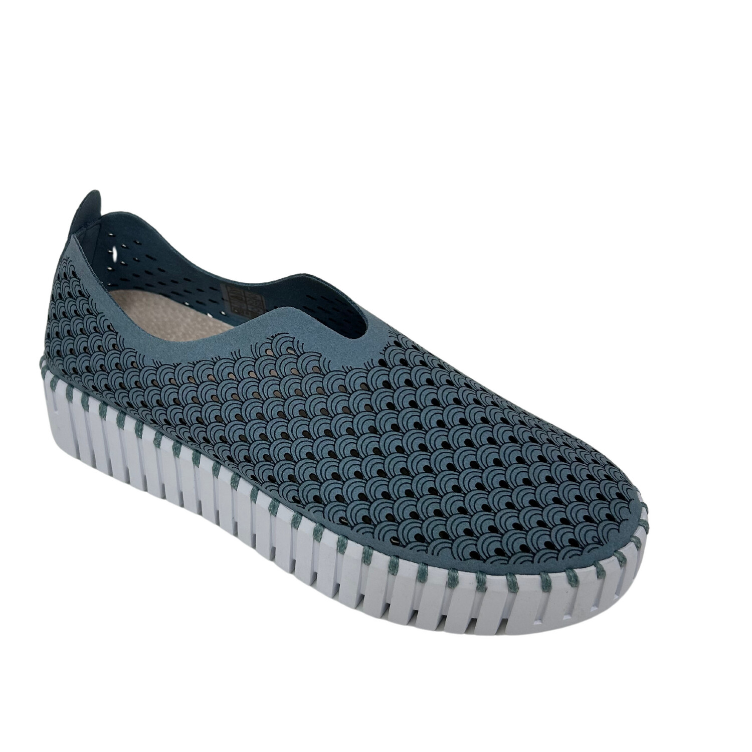Angled front view of a sneaker style slip on with a double thick white sole