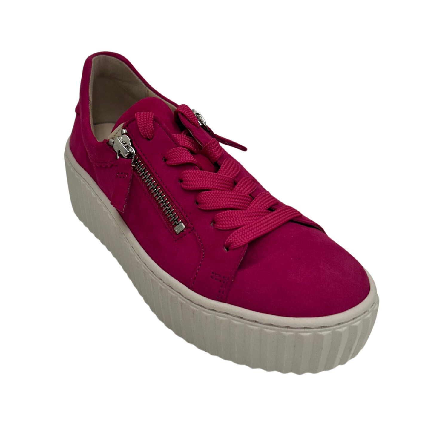 Angled view of a fuchsia pink leather sneaker with a white sole