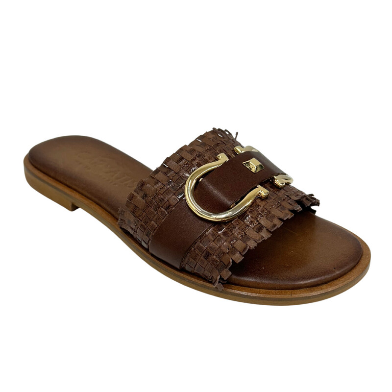 Angled front view of a slide in a rich brown/cognac.   Wide woven textured leather and across mid-foot.  Open toe and heel.  Gold buckle detail across the top.