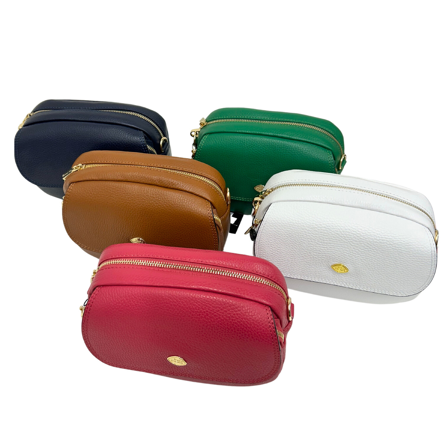 A selection of handbags with a rectangular shape.  Zipper across the top.  Shown in fuchsia, white, cognac, green and marine.