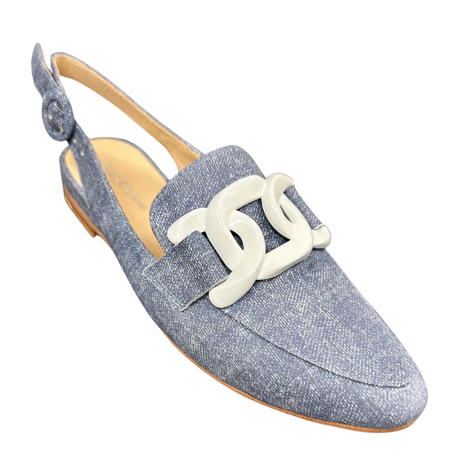 Angled front view of a slingback loafer in a soft denim blue shade with a white chain across the top.  Shop Django &amp; Juliette Favillas.