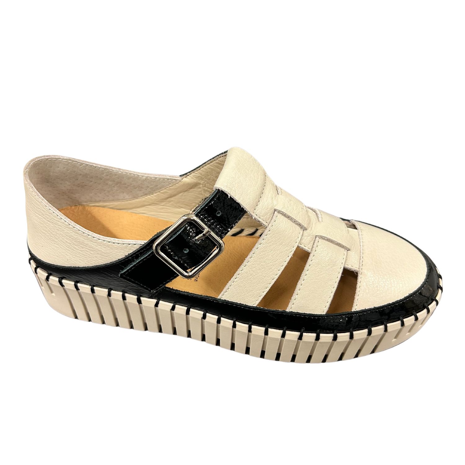 Outside view of a Fisherman style sandal with a rugged, sneaker style sole