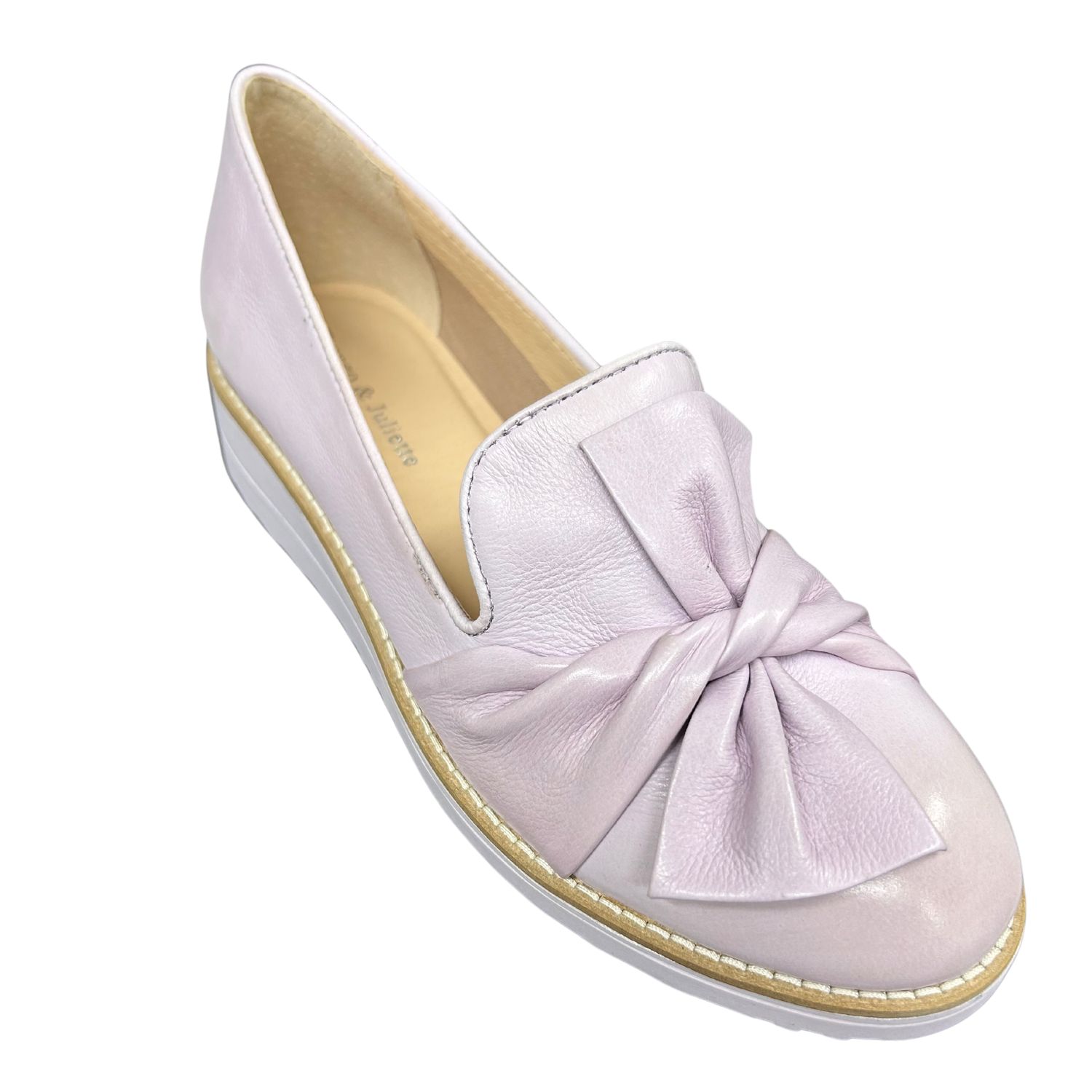 Angled front view of a beautiful loafer with a leather twist on the front.  Shown in a soft shade of lilac leather