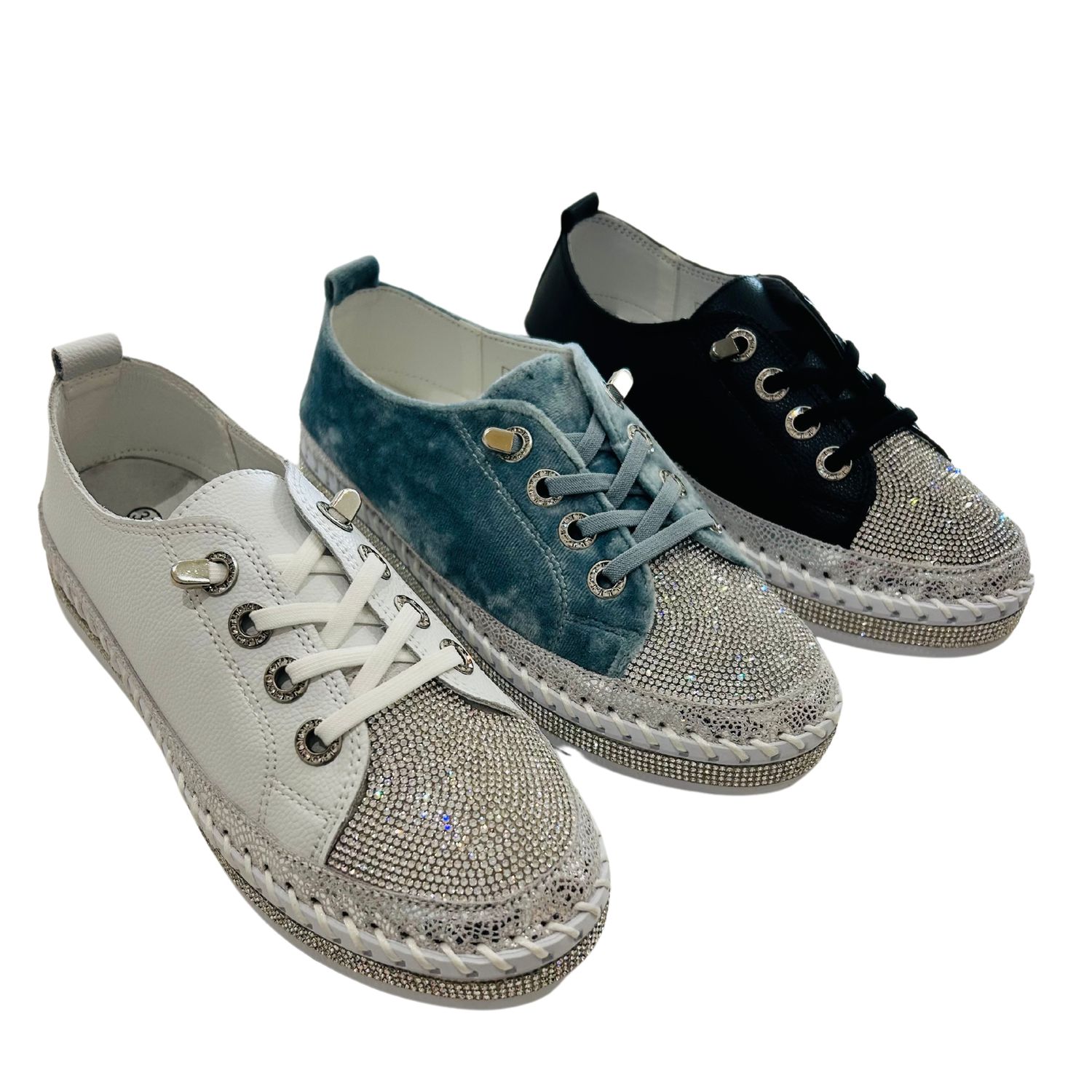 Angled front view of a sneaker in 3 colors - white, baby blue and black.  Toe box is all crystals.