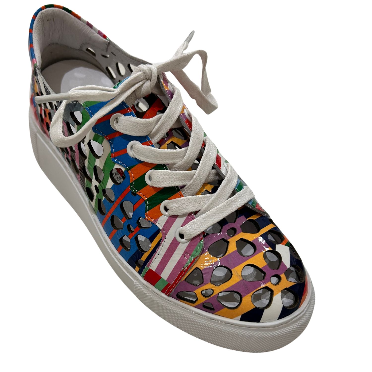 Angled front view of a multi-color sneaker with white laces and laser cut outs.  Shop Django &amp; Juliette Yarry