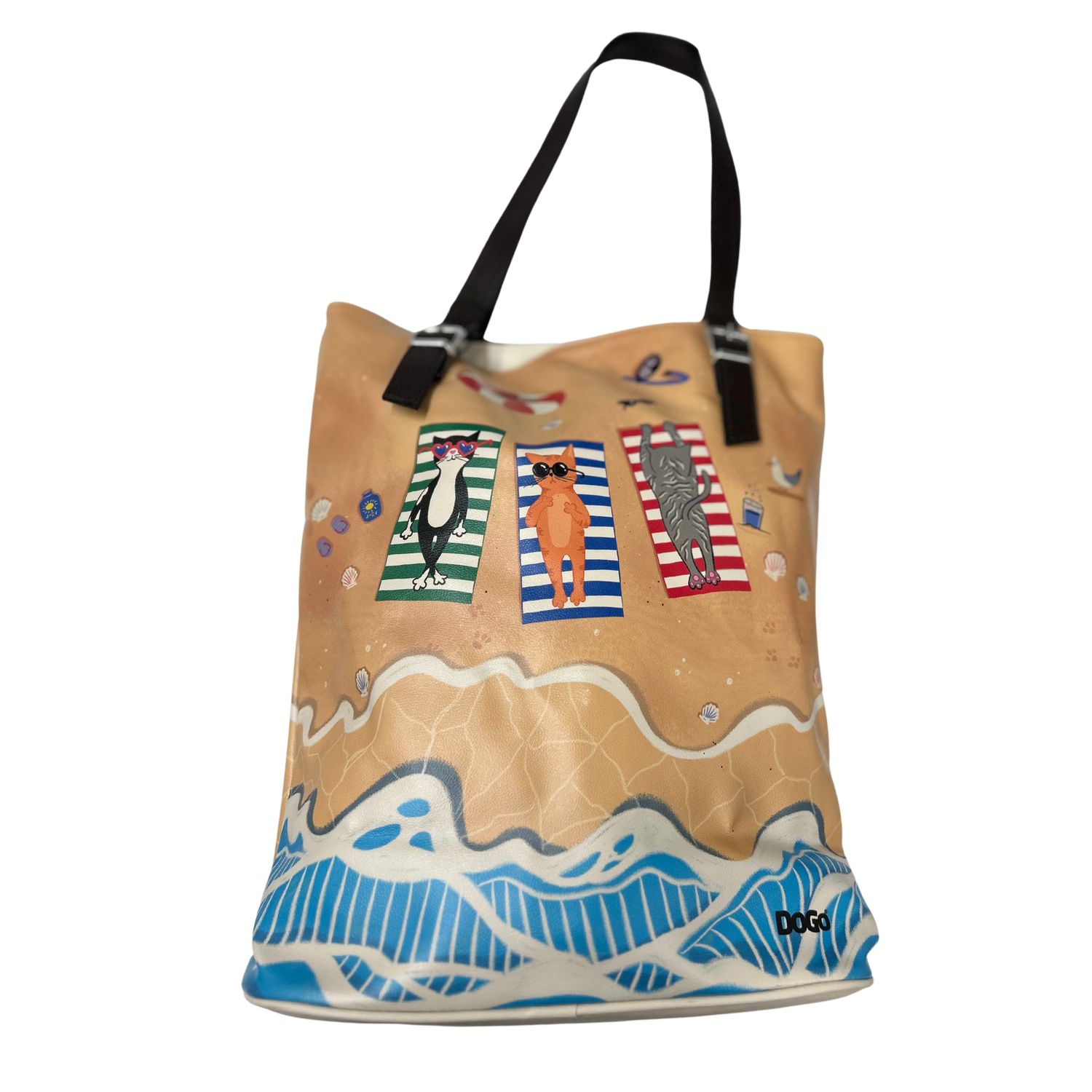 Front view of a vegan tote bag with a painted pattern of striped cats on a beach.