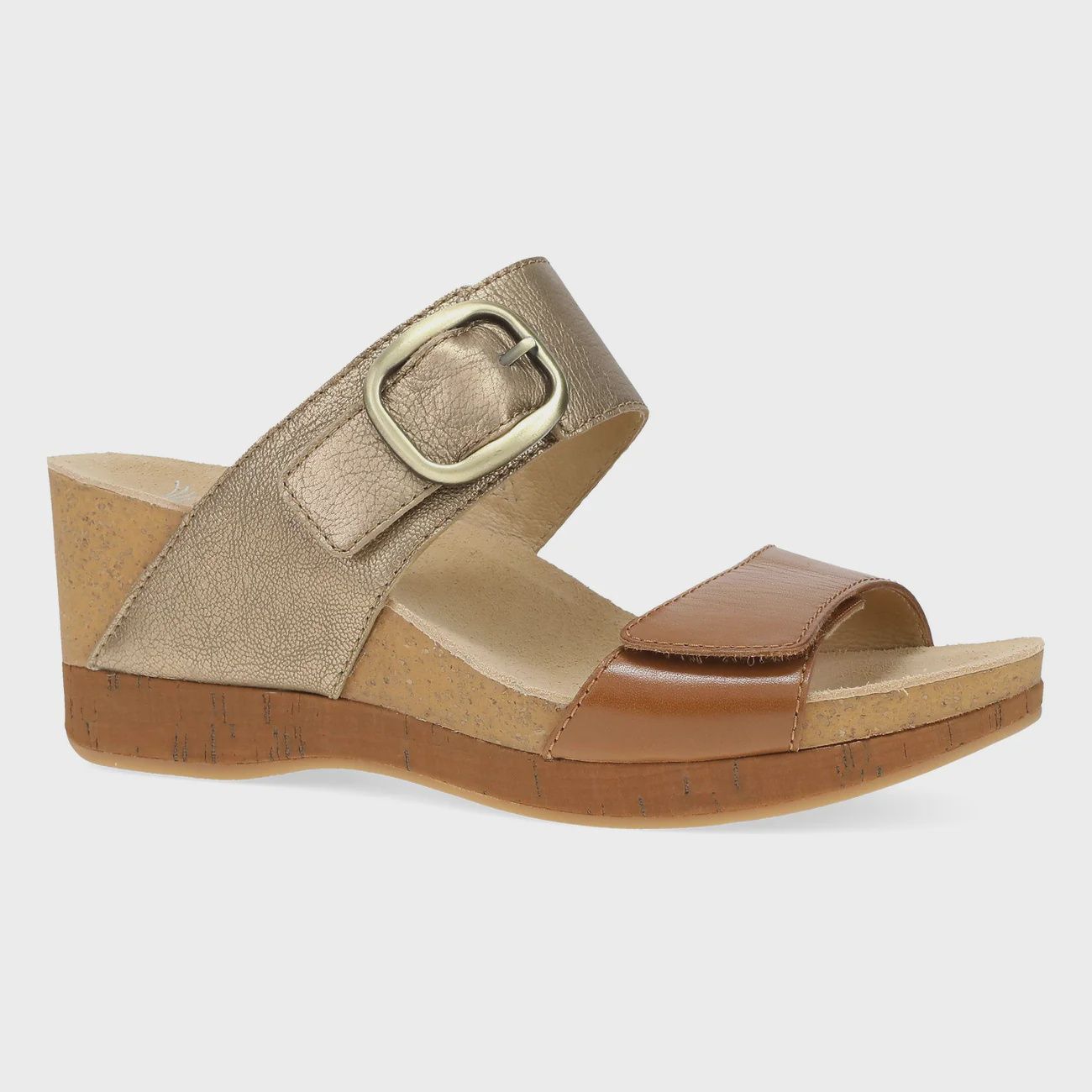 Angled front view of the Dansko Shannon wedge sandal.  Shown in a combo of tan and bronze leather combo.  Both bottom and top strap are adjustable.
