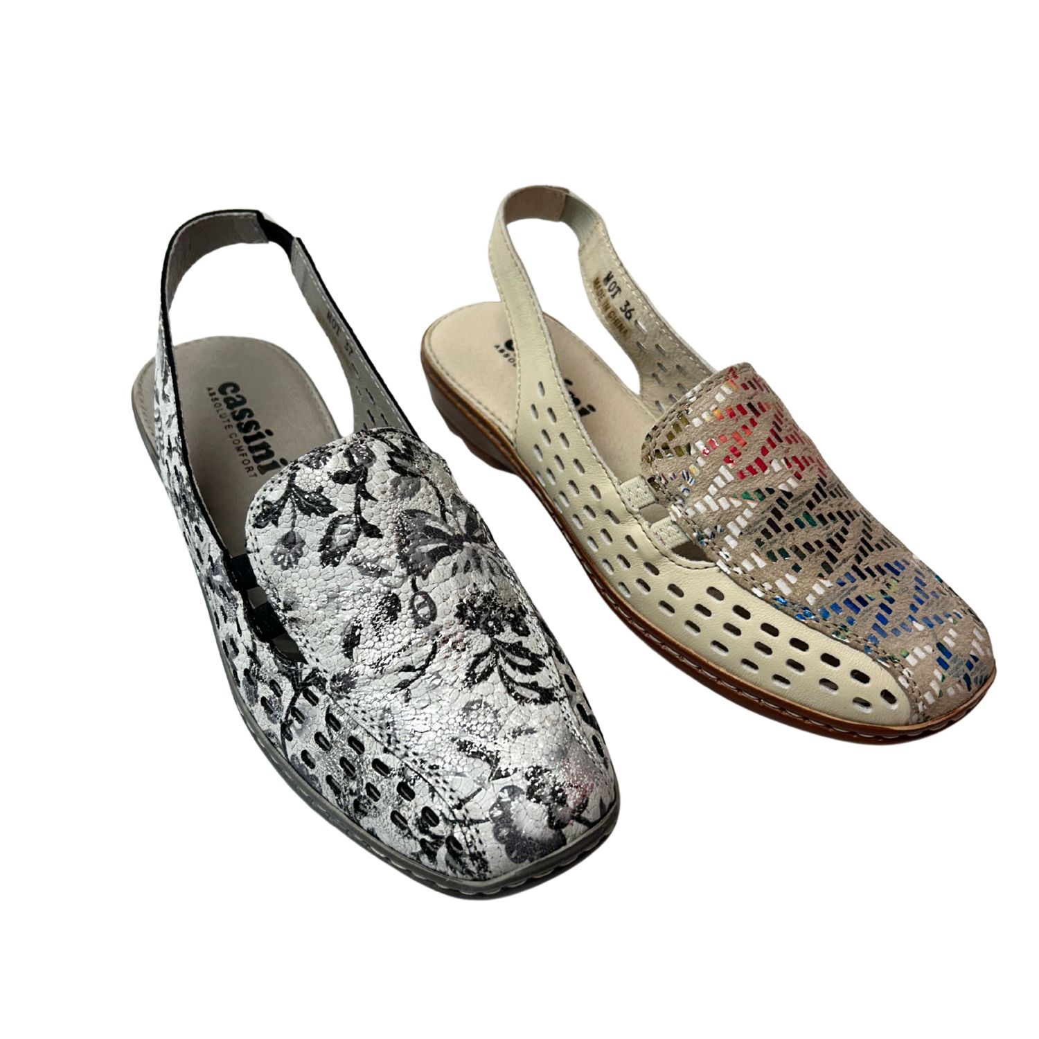 Angled front view of flat, slingback shoe.  Shown in 2 colorways.  One is a cream with multi-colored piece at the top.  The other is white and black.
