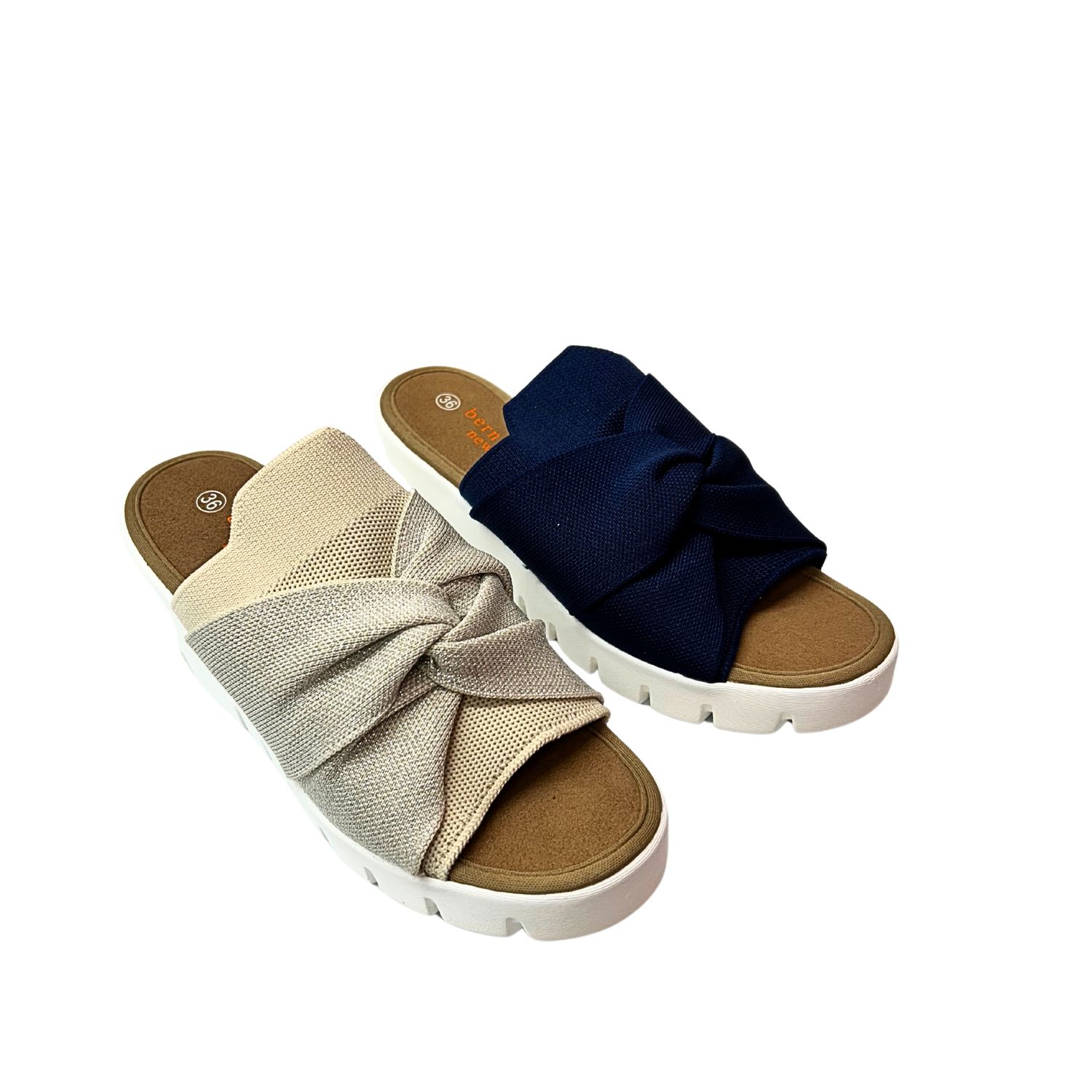 Angled front view of a fun summer wedge with an elasticized textile upper.  Upper features a twisted knot design. Shown in beige and black.