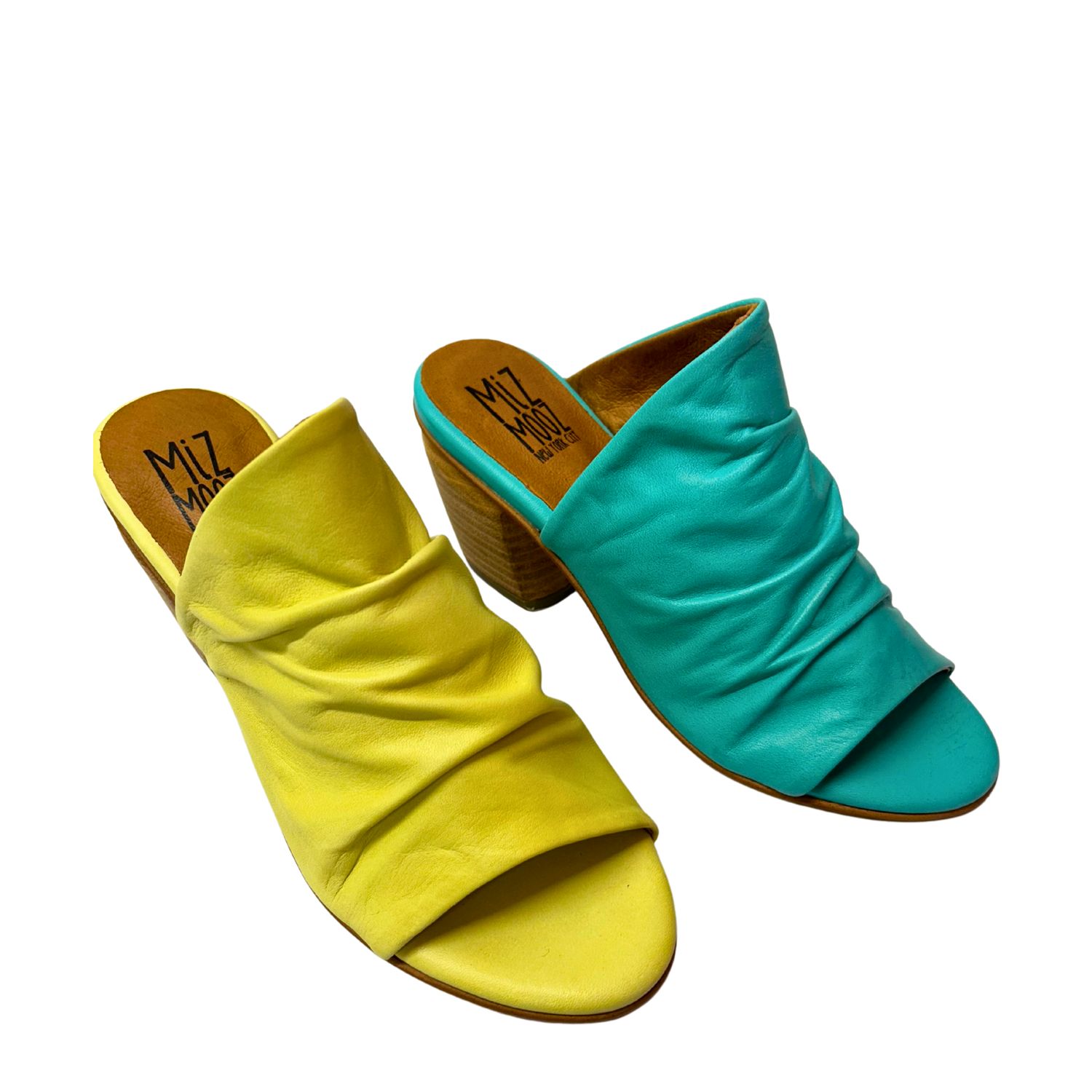 Angled front view of a mule style shoe.  Soft leather upper is ruched and runs from open toe area up to the top of the foot.  The top line is asymmetrical.  Shown in a citrus and turquoise.