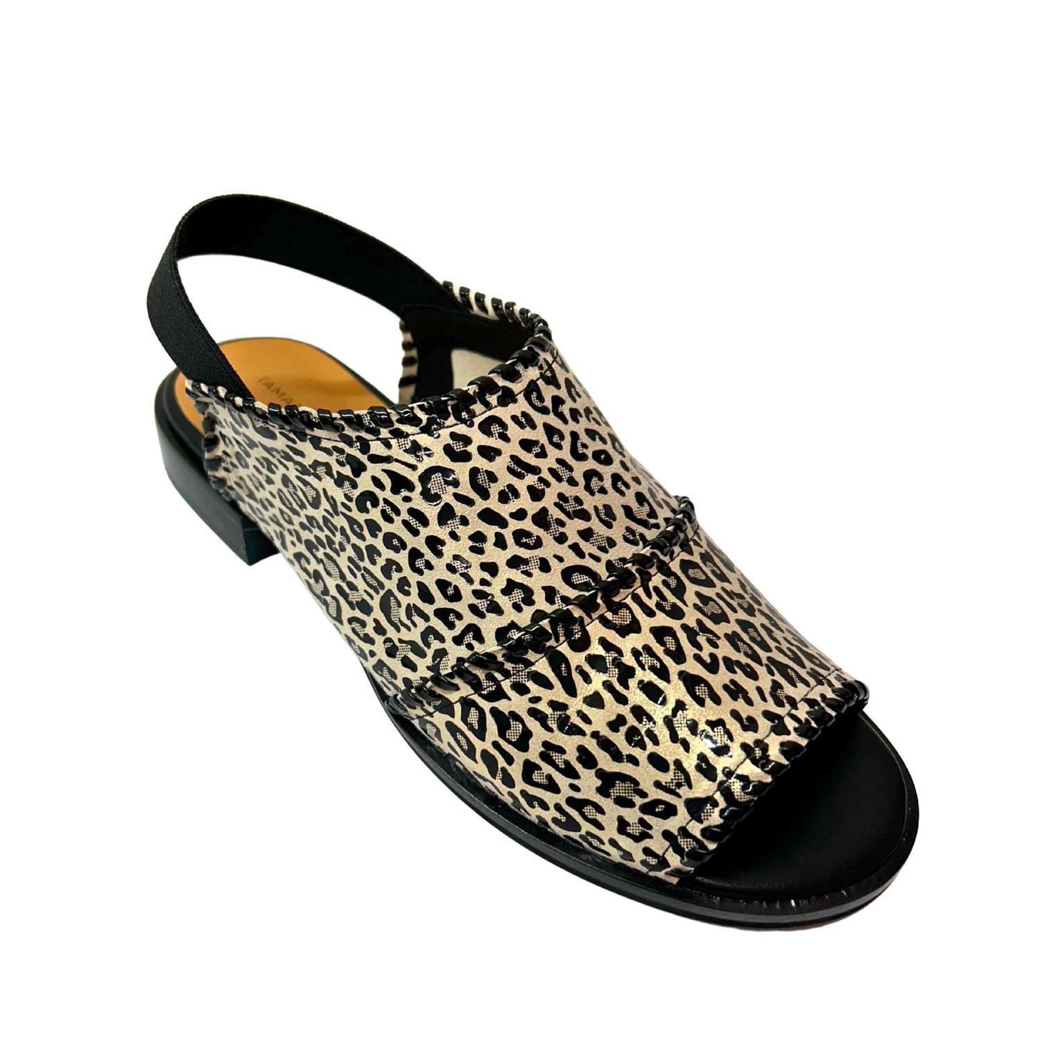 Angled front view of a sandal in a leopard print.  Textile upper.  Open toe and heel.
