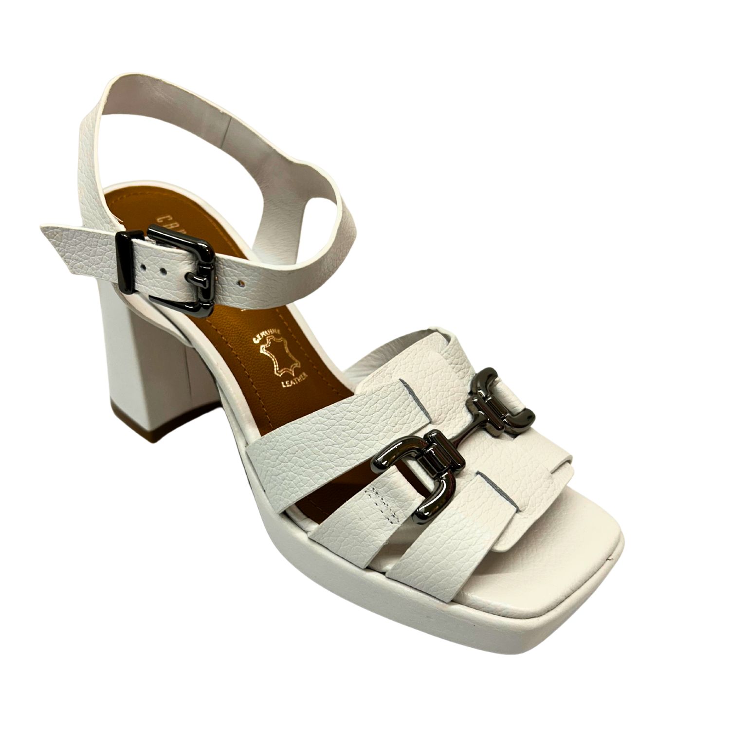 Angled front view of a white leather sandal with a block heel.  Shop Capelli Rossi