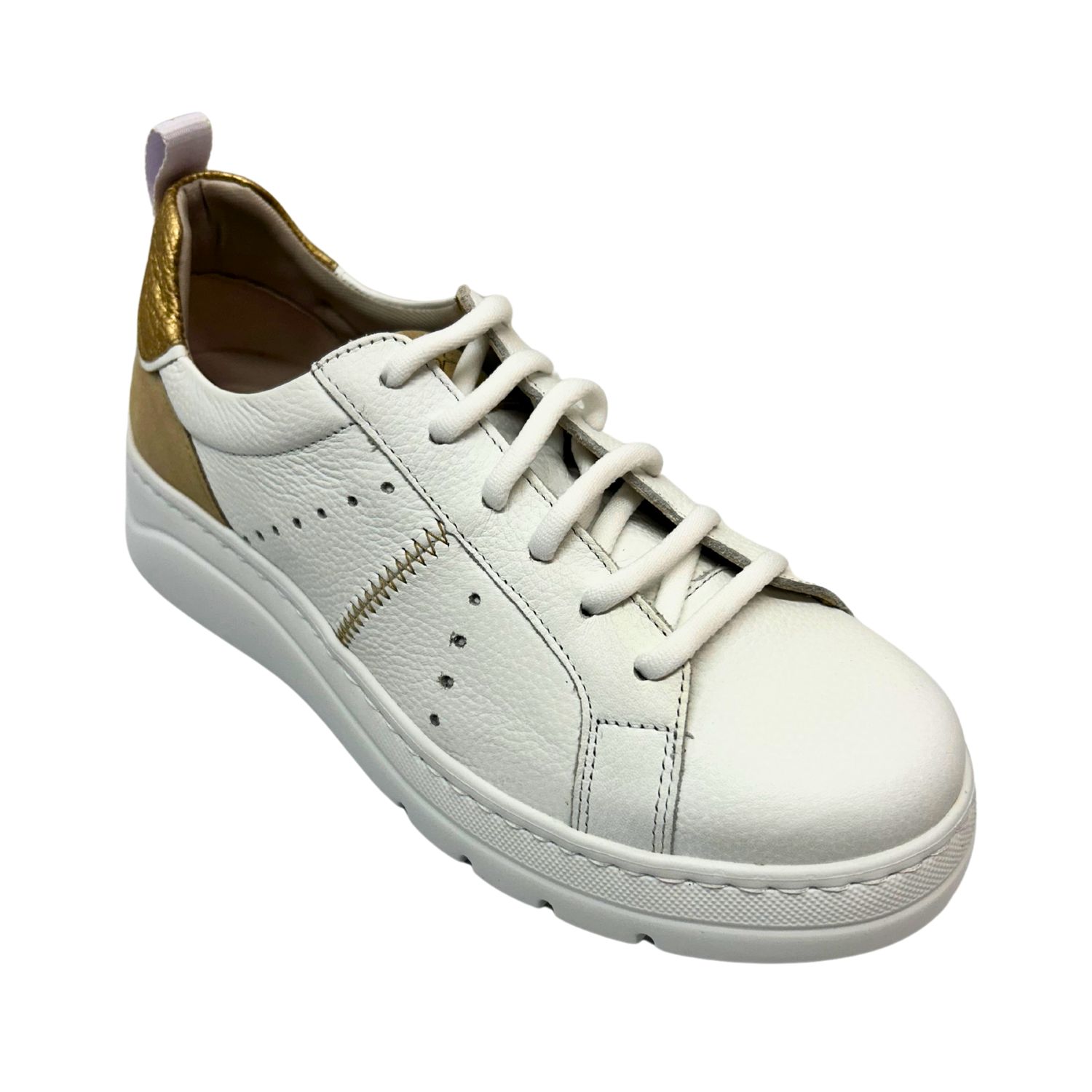 Angled front view of a white leather sneaker with white laces.  