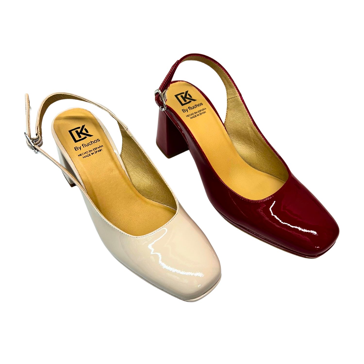 Angled front view of a slingback pump.  Soft, square toe.  Simple upper with an adjustable back strap.  Shown in 2 patent leather colors - cream and ruby red.
