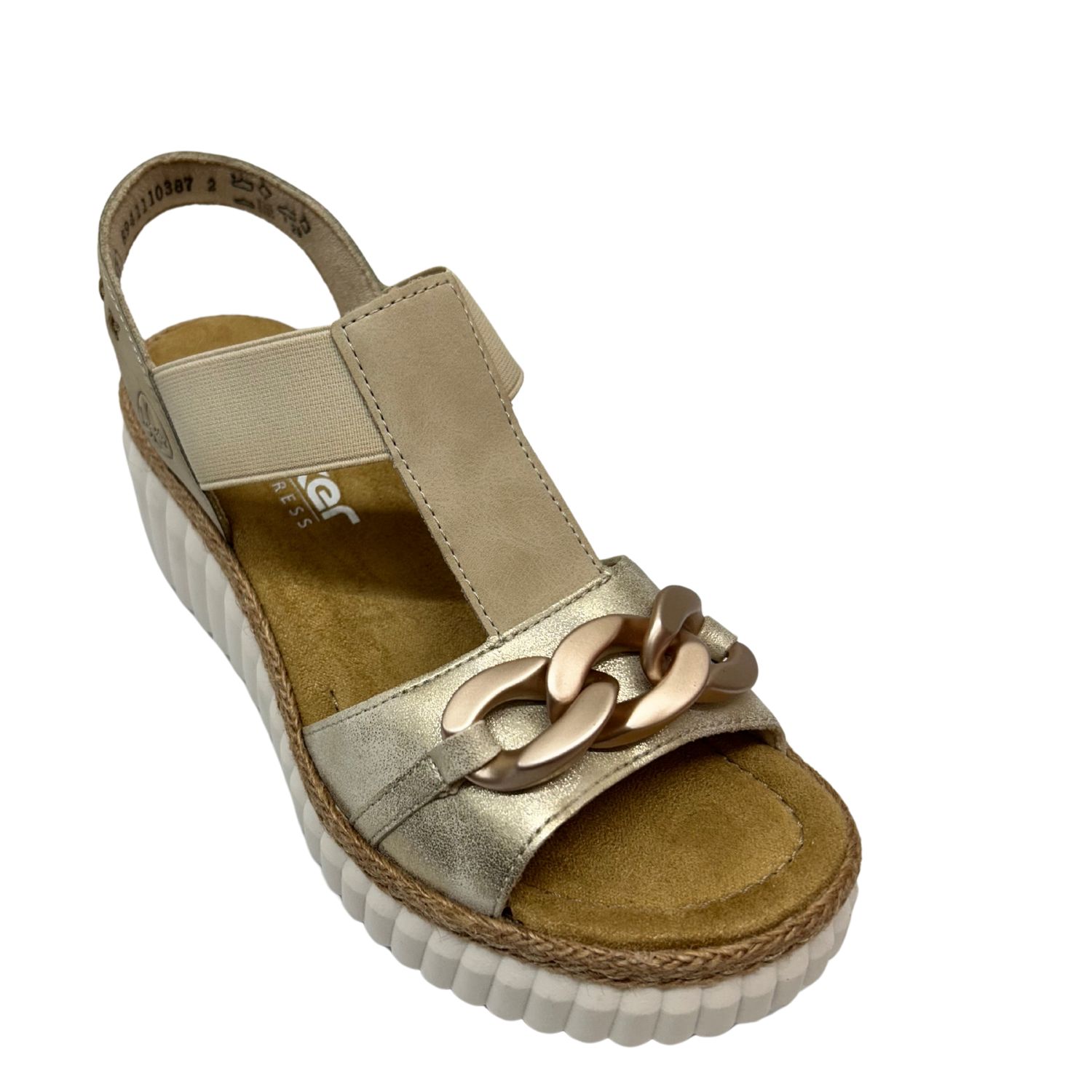 Angled front view of a wedge sandal in a neutral beige/soft gold combination.
