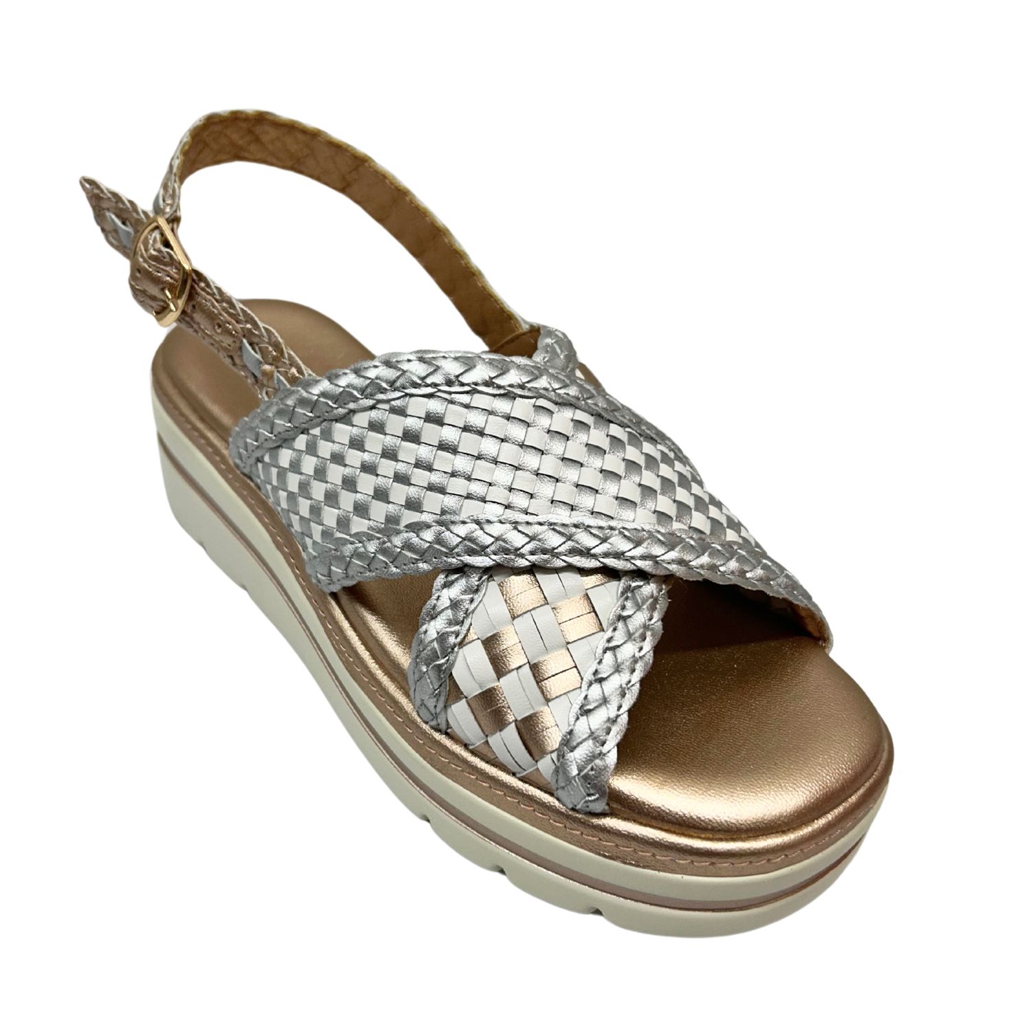 Angled front view of a metallic leather wedge sandal.  Thick, cross over straps and open toe and heel. 