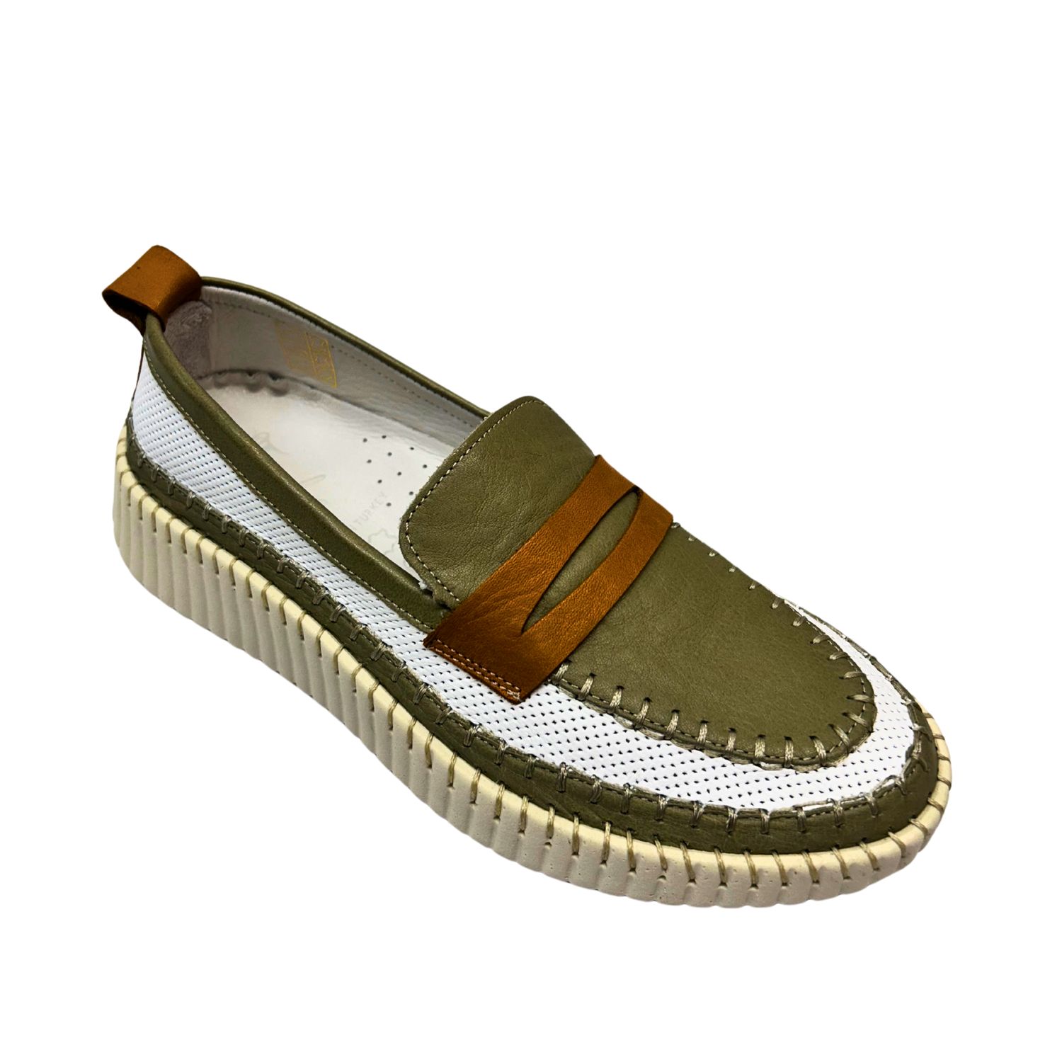 Angled front view of a casual loafer with a combination leather and mesh upper with a rubber sole.