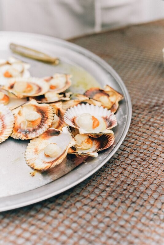 SCALLOPS IN COCONUT CREAM (Scallops, onions and coriander cooked with coconut cream and encased in a short crust pastry)