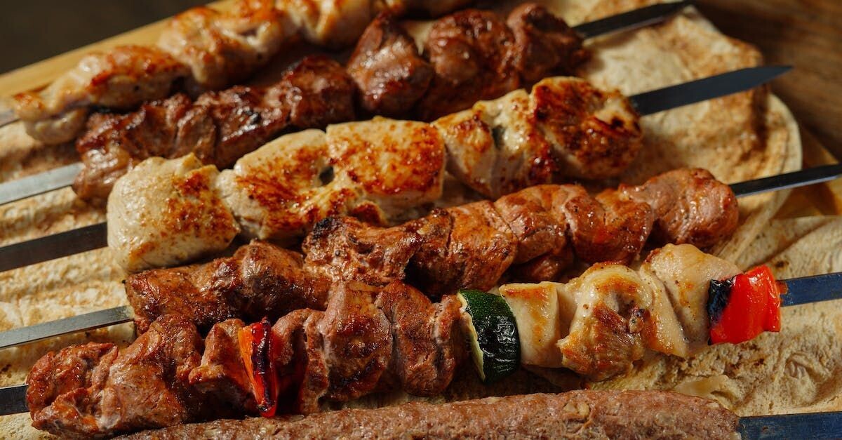 LAMB KEBABS (Spiced lamb meatballs baked and pan tossed in light tomato chutney)