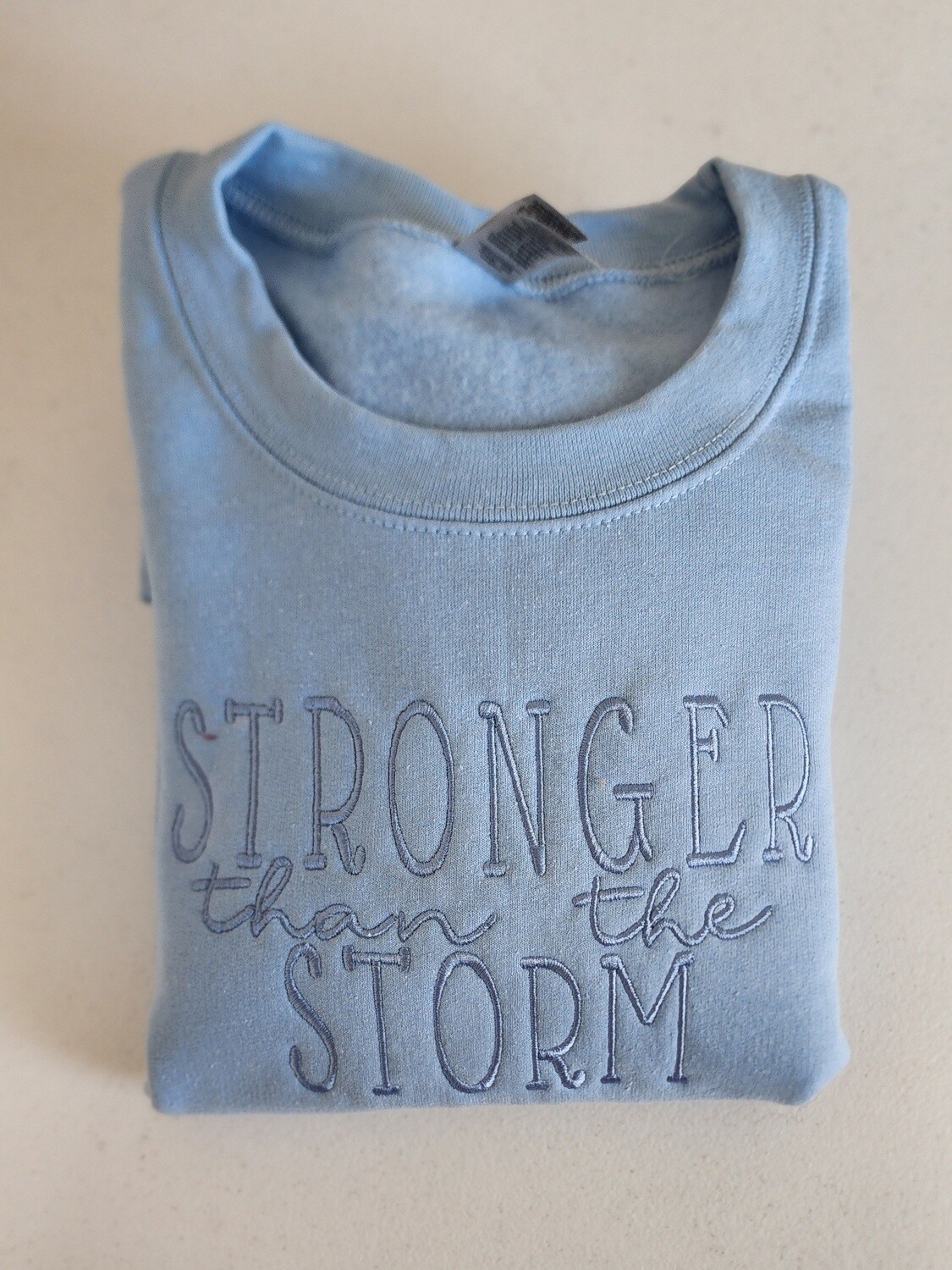 Stronger Than The Storm Embroidered Sweatshirt