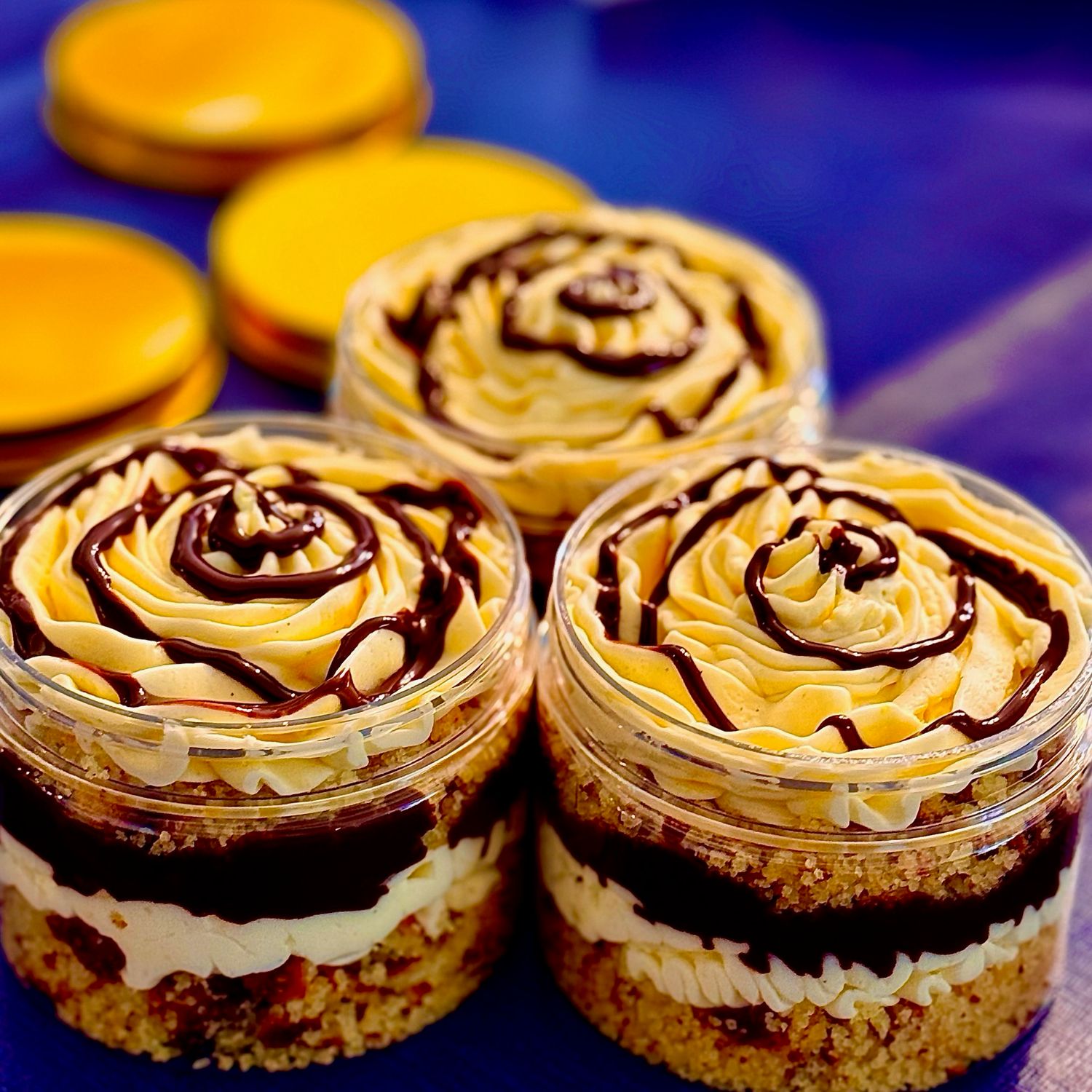 3 low carb Boston Cream Pie Cake Parfait Jars, made without erythritol. Featuring a light, creamy texture, and zero carb chocolate ganache, delivering the authentic taste of the real thing in a keto-friendly dessert.