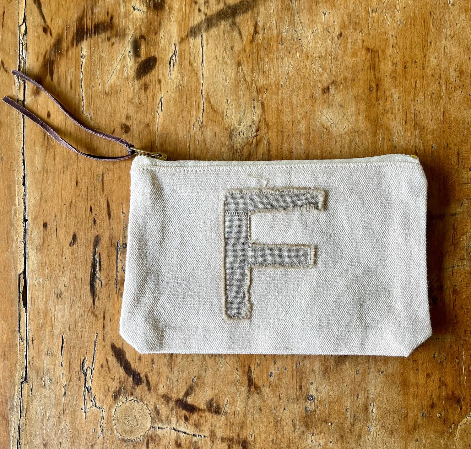 Initial Pouch, F