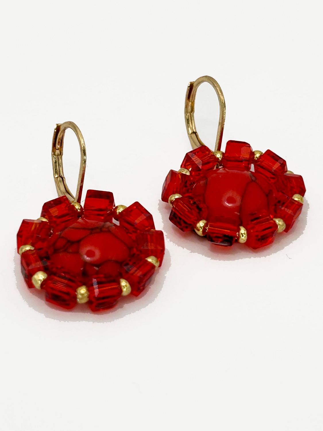 Lulua, gold colored stainless steel ear hook with red Turquoise.
