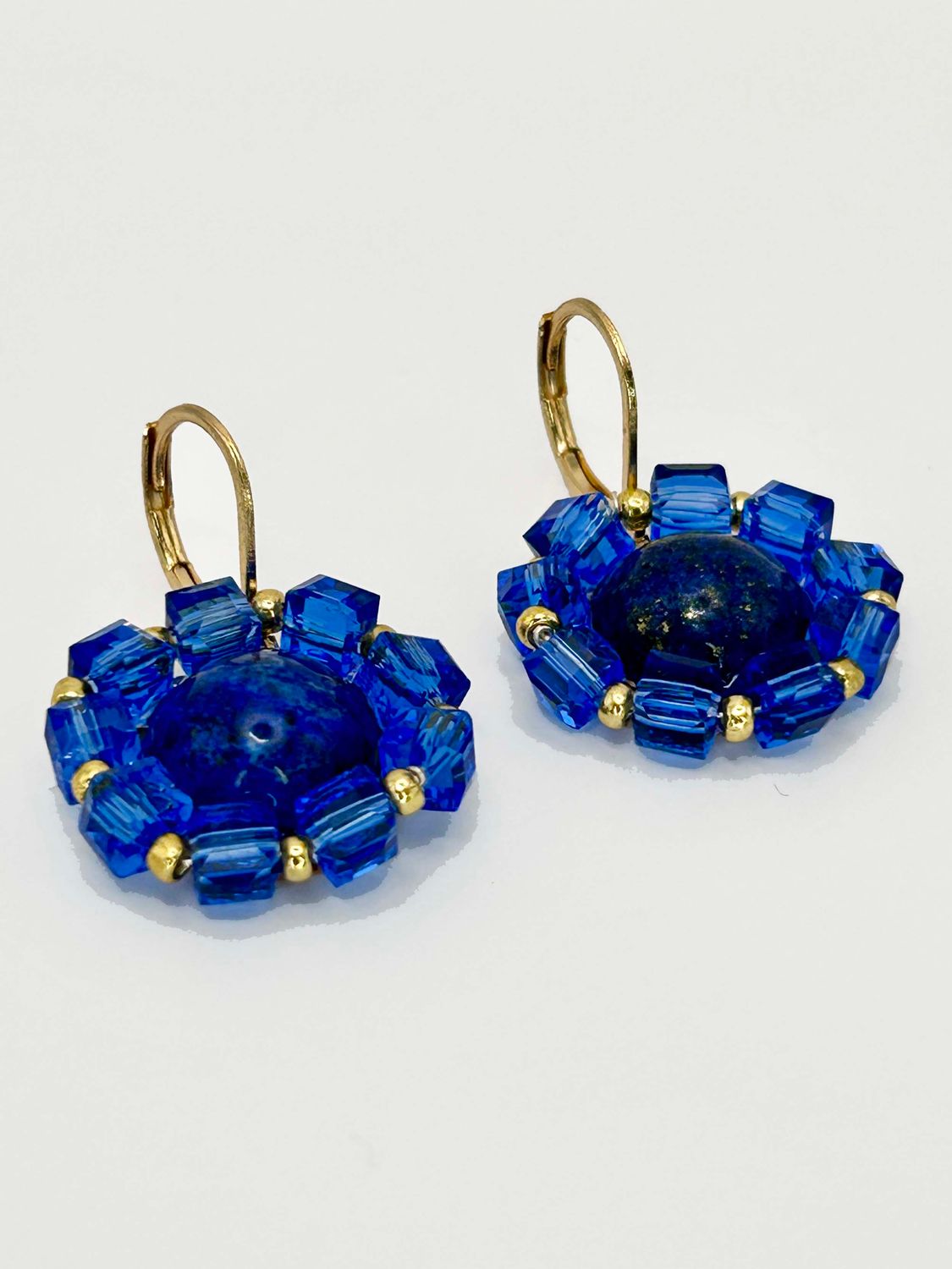 Lulua, gold colored stainless steel ear hook with Lapis Lazuli.