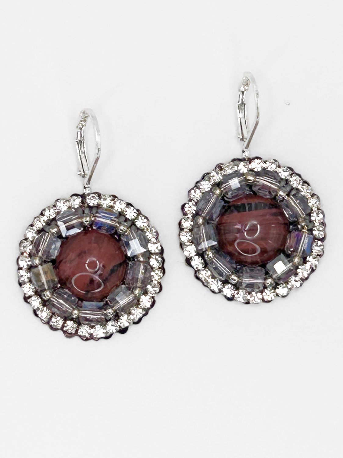 Malua, silver colored stainless steel ear hook with coral colored eye.