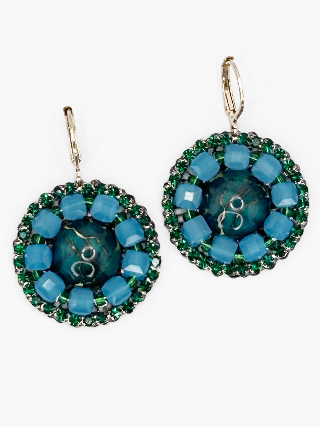 Malua, gold colored stainless steel ear hook with green fantasy eye.