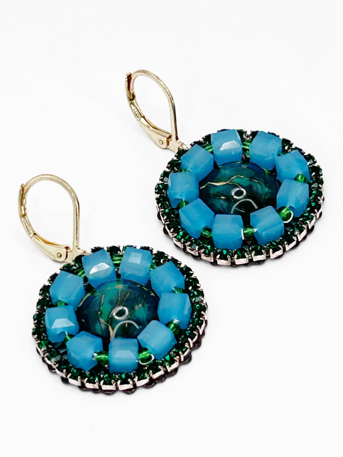 Malua, gold colored stainless steel ear hook with green fantasy eye.