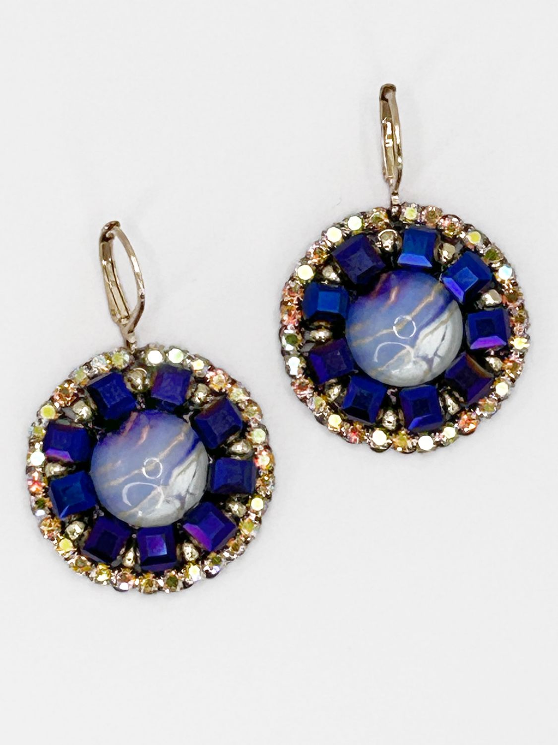 Malua, gold colored stainless steel ear hook with purple fantasy eye.