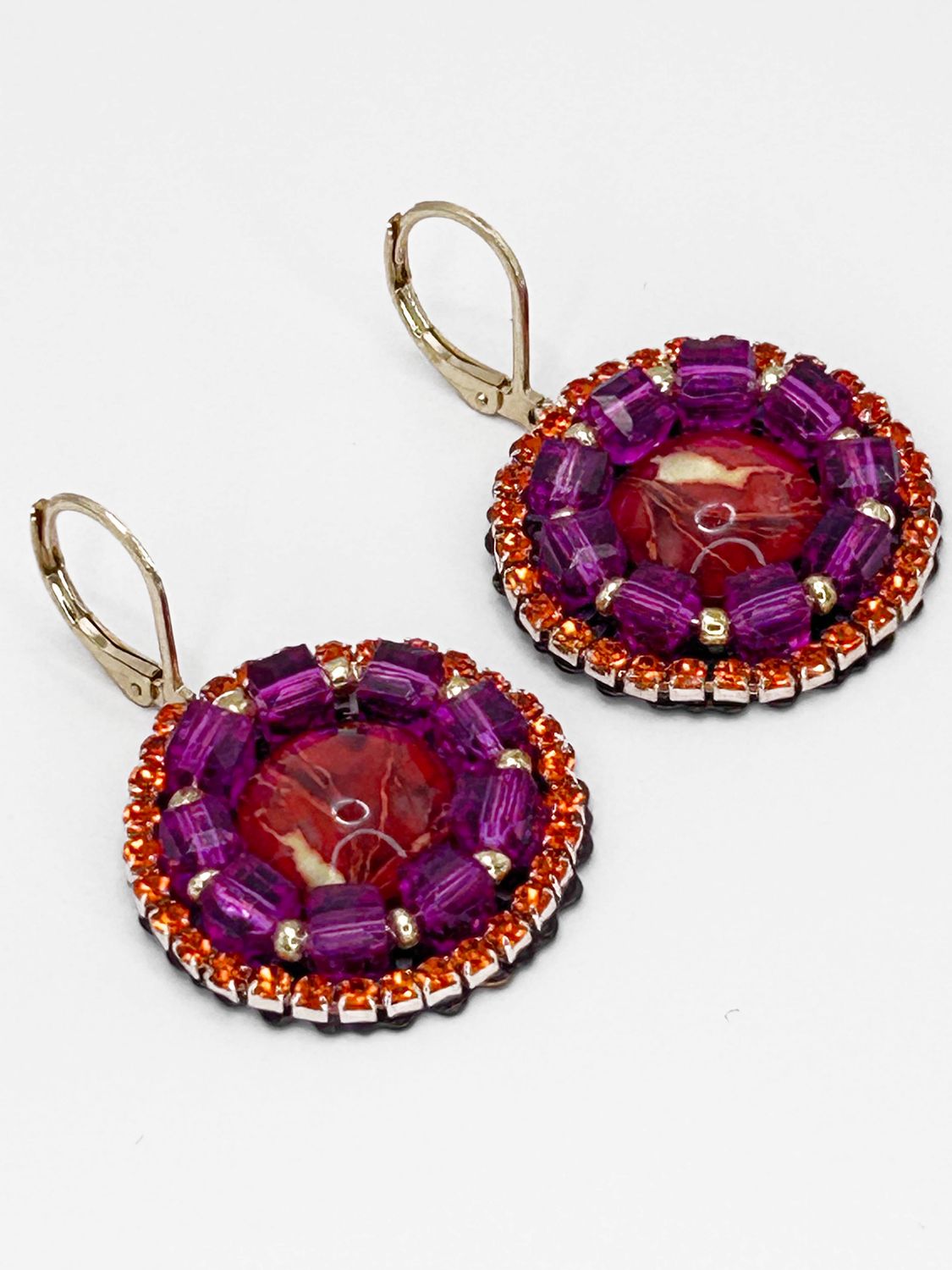 Malua, gold colored stainless steel ear hook with red fantasy eye.