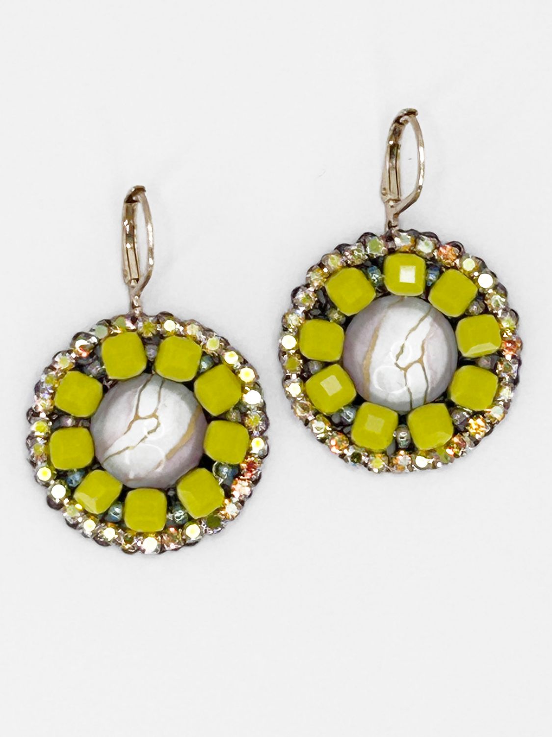 Malua, gold colored stainless steel with light pink fantasy eye.