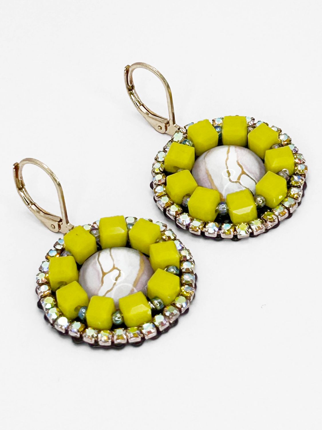 Malua, gold colored stainless steel with light pink fantasy eye.