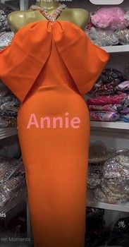 RAPH-ANIKA SCULPTED BOW HALTER BANDAGE DRESS