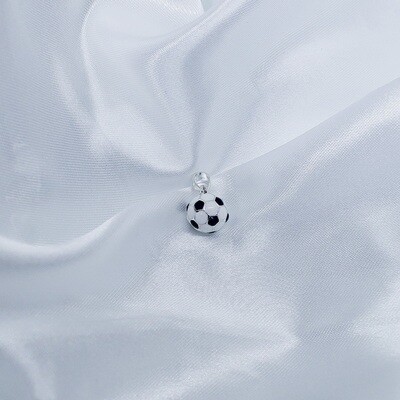 Dije de pelota en blanco con negro