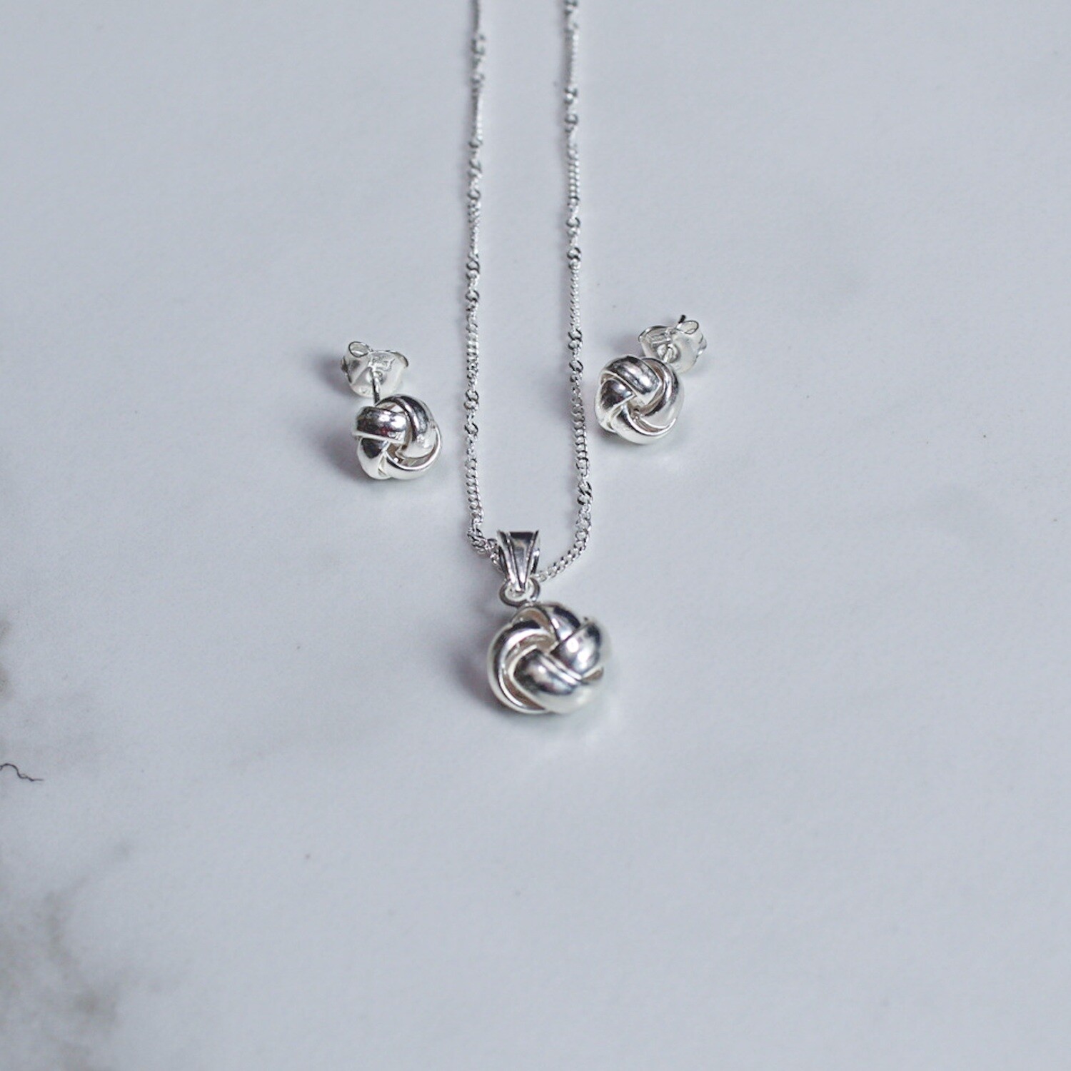 Juego entrelazado en plata italiana 925