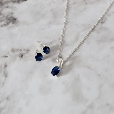 Juego con zirconia ovalado en color azul