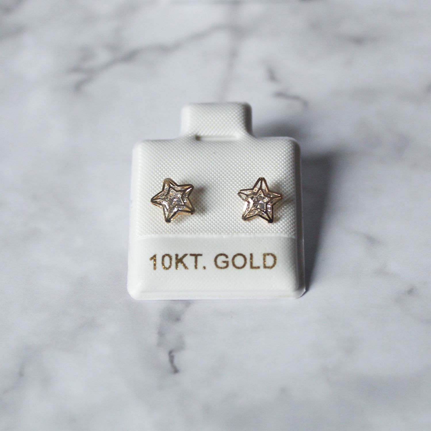 Aretes de Estrella silueta con zirconia en Oro 10KT