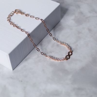Pulsera dama con dije infinito y zirconias en rose gold