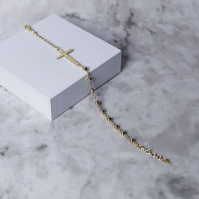 Pulsera de bolitas con cruz en plata italiana gold