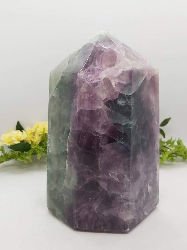 Rainbow Fluorite Tower with rainbow inclusions. Chipped point