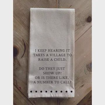 I keep hearing it takes a village Kitchen Towel