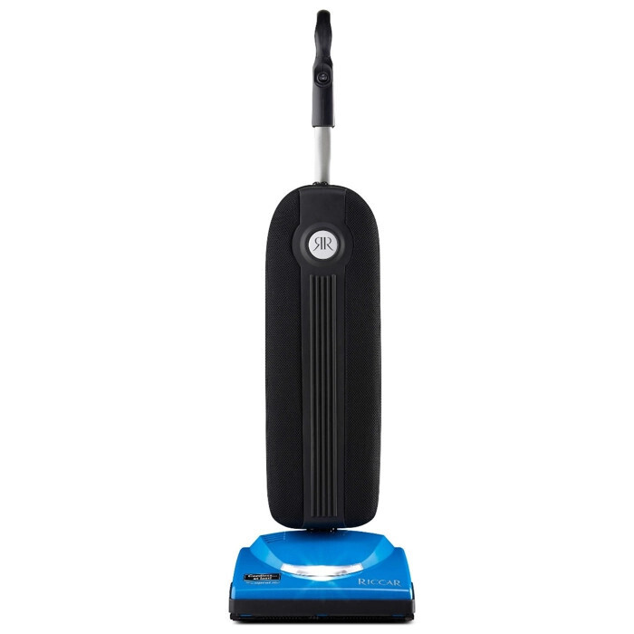 Riccar Cordless SupraLite lightweight bagged upright vacuum displaying its low-profile frame and front LED headlights.