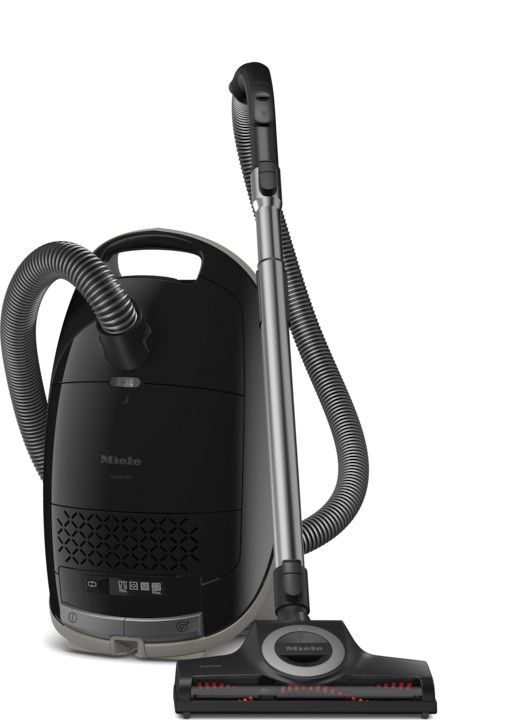 Obsidian Black Miele Guard M1 Cat and Dog canister vacuum displaying the SEB 228 electro powerhead and handheld turbo tool.